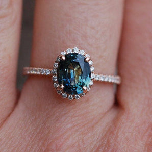 Oval Peacock Sapphire Halo Ring