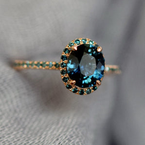 Oval Teal Sapphire Halo Ring