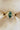 Front view of EidelPrecious Fiore Alpha + Beta engagement ring featuring a 2ct green marquise lab-grown diamond, hummingbird-inspired 14k yellow gold setting and lab diamond accent